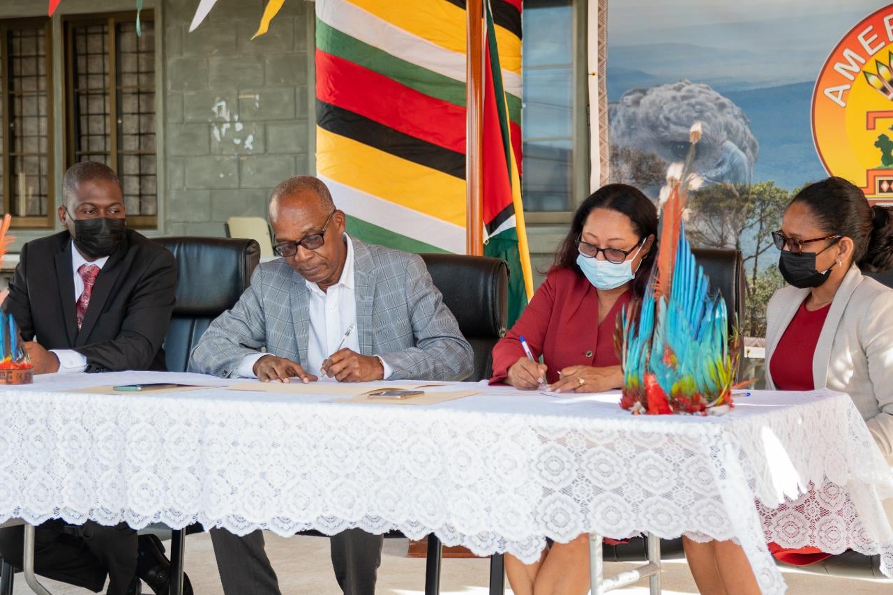 Minister of Labour, Joseph Hamilton and Minister of Amerindian Affairs, Pauline Sukhai sign the MOU