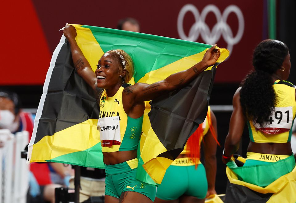 Elaine Thompson-Herah of Jamaica celebrates winning the gold medal REUTERS/Kai Pfaffenbach