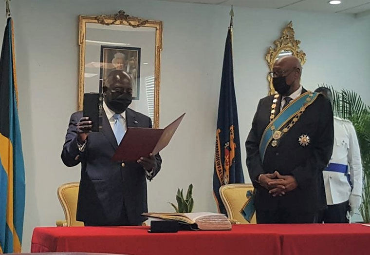 Newly elected Prime Minister of The Bahamas Mr Phillip Davis takes the oath of office.