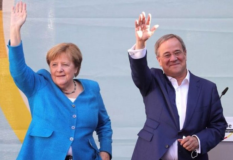 Outgoing Chancellor Angela Merkel and her party's candidate to replace her, Armin Laschet, spoke at a rally on Saturday