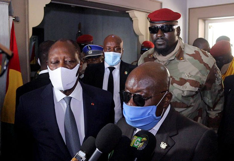 Ghana's President Nana Akufo-Addo speaks to members of the media as Ivory Coast's President Alassane Ouattara, and Guinea's Special forces commander Mamady Doumbouya, who ousted President Alpha Conde, stand next to him after their meeting to discuss ways to return Guinea to constitutional order, in Conakry, Guinea, September 17, 2021. REUTERS/ Souleymane Camara