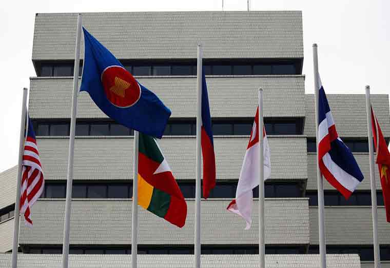Flags are seen outside the Association of Southeast Asian Nations (ASEAN) secretariat building, ahead of the ASEAN leaders' meeting in Jakarta, Indonesia, April 23, 2021. REUTERS/Willy Kurniawan/File Photo