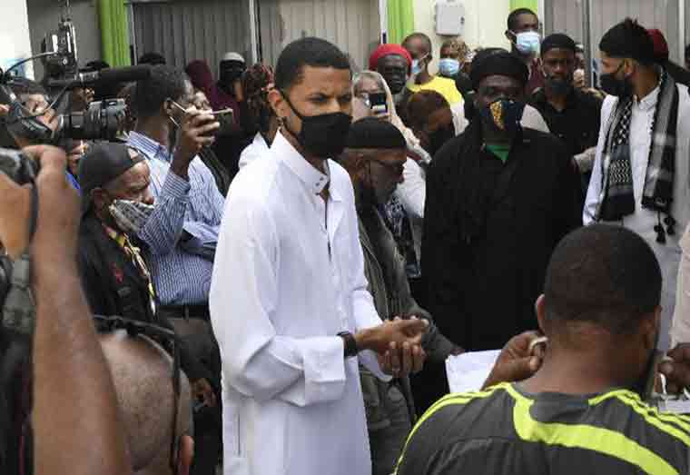 ‘Death a step in life’s journey’: Fuad Abu Bakr, son of Imam Yasin Abu Bakr, addresses mourners during his Janazah at the Jamaat-al-Muslimeen Masjid, Mucurapo Road, St James, yesterday. —Photo: JERMAINE CRUICKSHANK