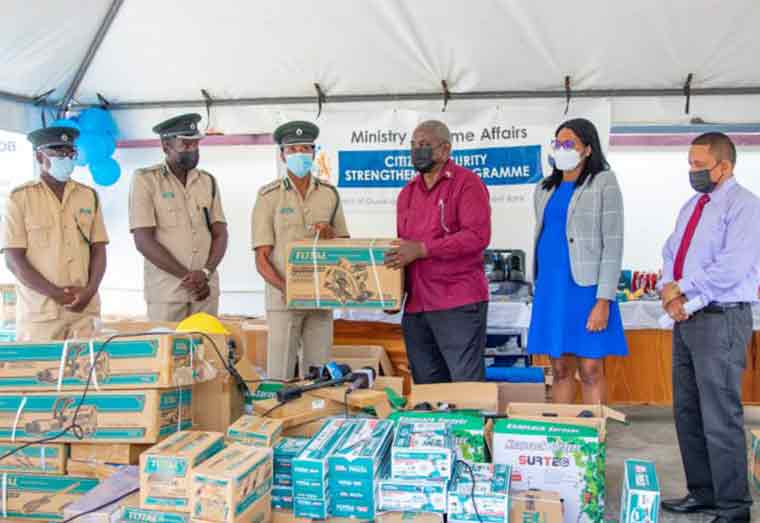 Minister of Home Affairs, Robeson Benn, MP hands over equipment and tools to the Director of Prisons (Ag), Nicklon Elliot