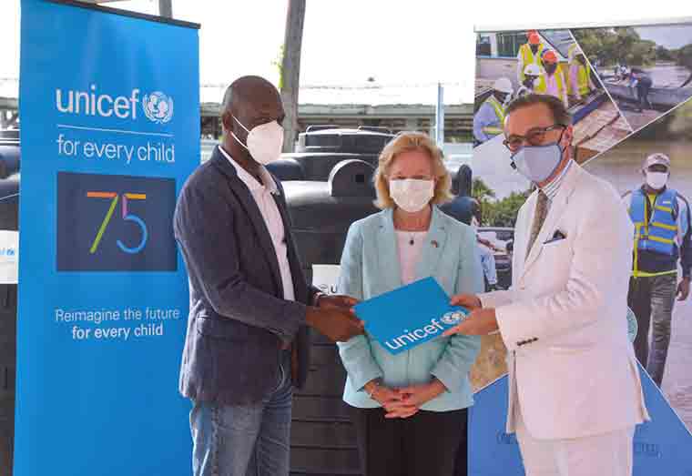 UNICEF Representative Nicolas Pron formally hands over the 100 water tanks to CDC Director General, Lieutenant Colonel Kester Craig in the presence of United States Ambassador to Guyana, H.E Sarah-Ann Lynch on Friday, November 5, 2021.
