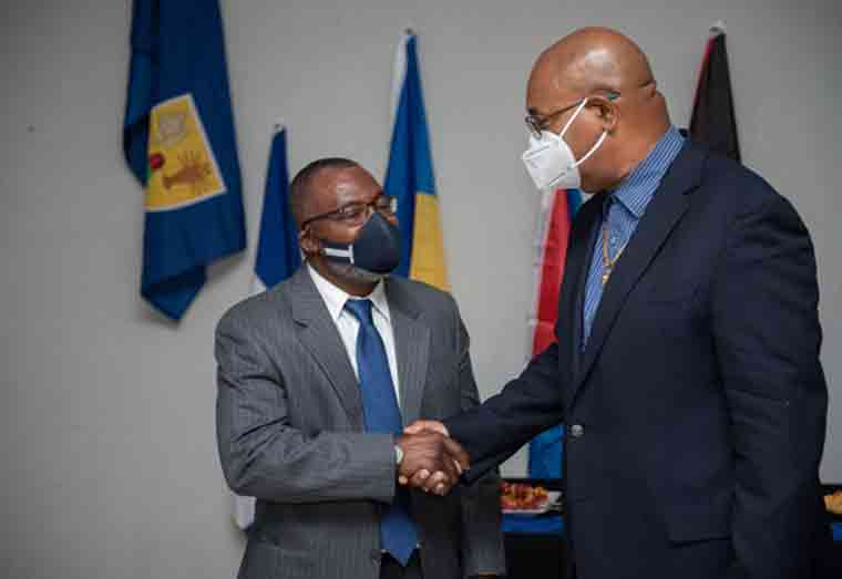 Minister of Public Works, Bishop Juan Edghill greets Chairman of Inter-Caribbean Airways, Mr. Lyndon Gardiner