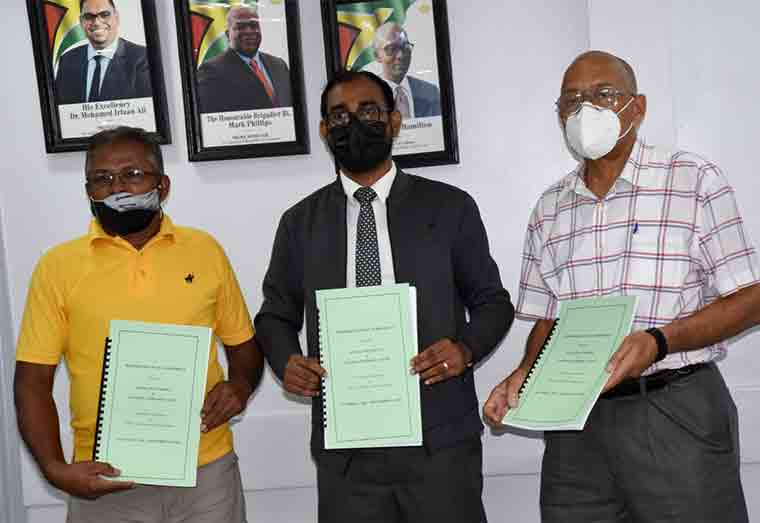 Chief Labour Officer Mr. DhaneshwarDeonarine (Centre), Human Resources Director Mr. Andrew Carto (right) and General Secretary of the General Workers Union Mr. Pancham Singh (left) display the MOA following the signing. 