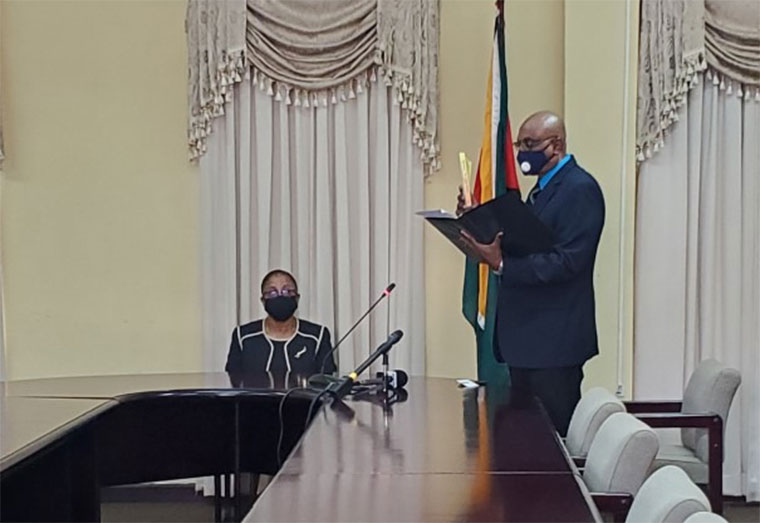 Newly appointed Chief Elections Officer, Vishnu Persaud taking his oath as Commissioner of Registration before Chief Justice Roxane George at the High Court on Tuesday