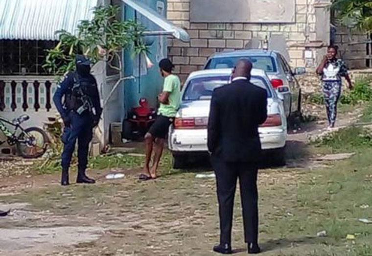 Police personnel the scene of yesterday’s triple murder in Bountry Hall, Trelawny. ( Hopeton Bucknor/Jamaican Gleaner)