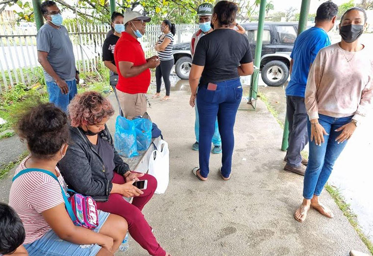 Family members of the missing divers anxiously await news of their loved ones, in Pointe a Pierre, on Saturday 26 February 2022. (Image by RISHI RAGOONATH)