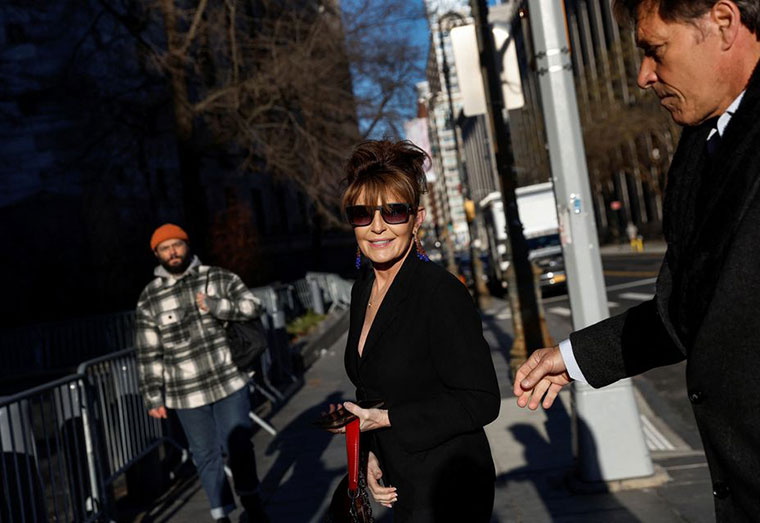 Sarah Palin, 2008 Republican vice presidential candidate and former Alaska governor, arrives with former NHL hockey player Ron Duguay during her defamation lawsuit against the New York Times, at the United States Courthouse in the Manhattan borough of New York City, U.S., February 11, 2022