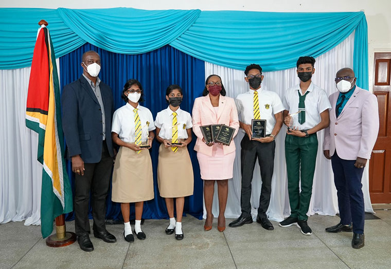 Some of the top awardees along with Ministry of Education Permanent Secretary, Mr Alfred King, Chief Education Officer, Dr, Marcel Hutson and Queen’s College acting Headmistress, Ms. Candacie Cave Some of the top awardees along with Ministry of Education Permanent Secretary, Mr Alfred King, Chief Education Officer, Dr, Marcel Hutson and Queen’s College acting Headmistress, Ms. Candacie Cave
