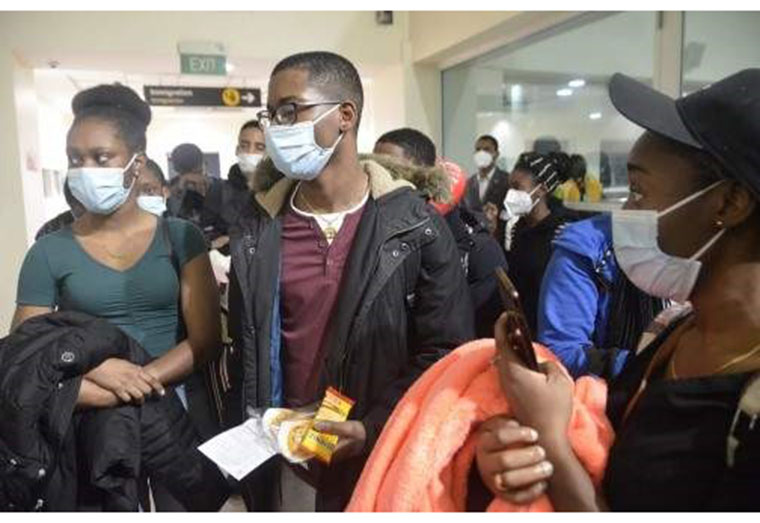 Some of the Jamaican students who arrived in the island Wednesday after fleeing Ukraine gather inside the VIP lounge at Sangster International Airport in Montego Bay shortly after their arrival. (Photos: Philp Lemonte)