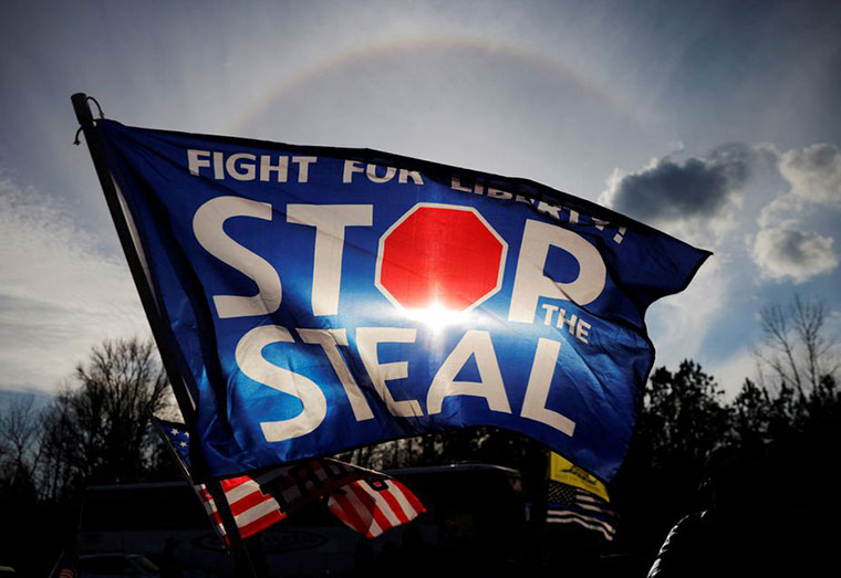 A "Stop the Steal" flag flies outside a campaign rally with U.S. President Donald Trump and Republican U.S. Senator Kelly Loeffler on the eve of Georgia’s run-off election in Dalton, Georgia, U.S., January 4, 2021. REUTERS/Brian Snyder/File