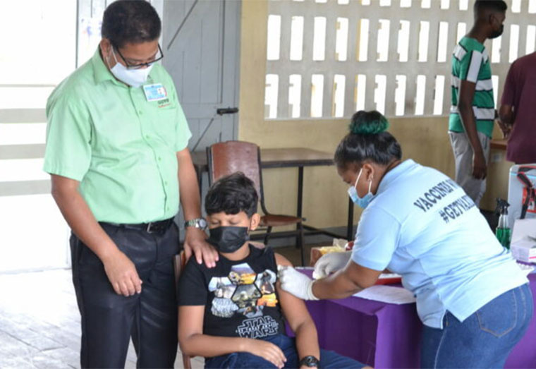 Adolescent getting vaccinated against COVID-19