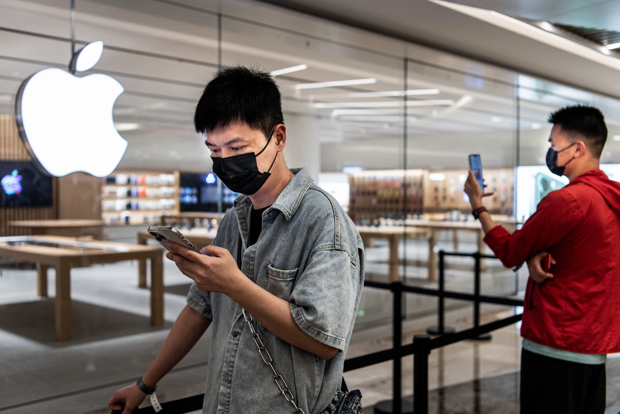Consumers await the opening of a new Apple Store in Wuhan, China, on May 21. Ren Yong /SOPA via Getty Images