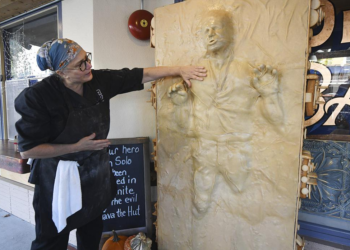 Catherine Pervan, with Our House Bakery in Benicia, Calif., talks about creating the life-sized Han Solo on Oct. 13, 2022 . The piece is the bakery's entry in the downtown Benicia scarecrow contest. (Chris Riley/The Times-Herald via AP)
