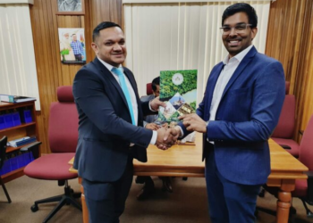 Minister Vickram Bharrat hands over approved Master Plan to the Director of Gulf Engineering, Mr Jodel Gopeesingh