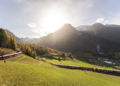 A train of the Rhaetian Railway (RHB) is on its way to set a world record for longest passenger train, on Saturday, October 29, 2022, in Berguen, Switzerland. The 1.91 kilometer long train is on a journey on the UNESCO world heritage track from Preda to Alvaneu. The train consists of 100 wagons. The old world record of 1732,9 meters dates back to 1991. (Yanik Buerkli/Keystone via AP)