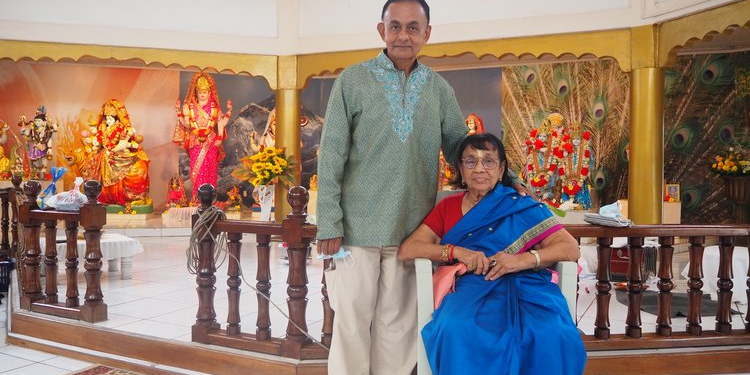 Sivindra Mangru, president of Peter’s Hall Mandir, with his mother