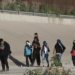 A group of Venezuelan migrants walks toward the United States border to surrender to the border patrol in Ciudad Juarez, Mexico