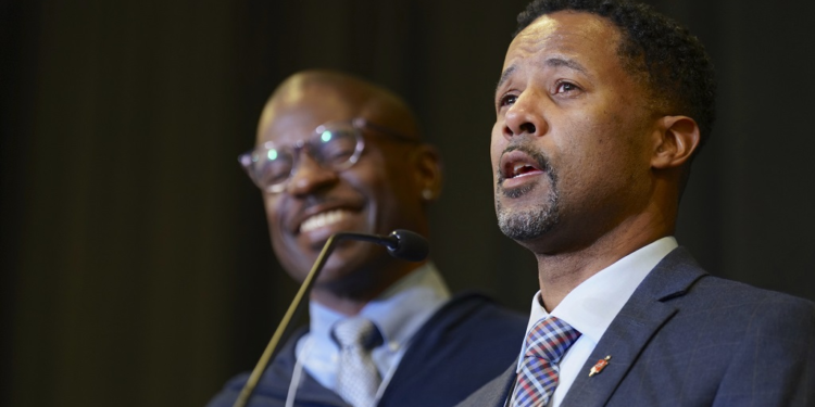 Bishop Cedrick Bridgeforth addresses the delegates, guests and his new episcopal colleagues, shortly after his election on November 4, 2022, at Christ United Methodist Church in Salt Lake City. At left is his husband, Christopher Hucks-Ortiz. Bridgeforth is the first openly gay African-American man to be elected bishop. (Patrick Scriven/United Methodist News via AP).