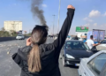 Authorities blocked roads, but failed to stop people reaching the cemetery where Hadis Najafi is buried