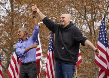 Former President Barrack Obama, left, finishes his remarks and welcomes Pennsylvania Lt. Gov. John Fetterman, a Democratic candidate for U.S. Senate, to the stage during a campaign rally in Pittsburgh, Saturday, Nov. 5, 2022. (AP Photo/Gene J. Puskar)