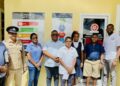 (L-R) Mabaruma Chamber of Commerce & Industry PRO Trevor Rupan, Regional Commander Snr. Sup. Himnauth Sawh, GNBS ED (ag) Ms. Ramrattie Karan, RC Mr. Brentnol Ashley, REO Mr. Bissessar Tikaram, Students of the Mabaruma Primary School who cut the ribbon, Director of Business Mr. John Edghill and Mayor of Mabaruma His Worship Chris Phang.