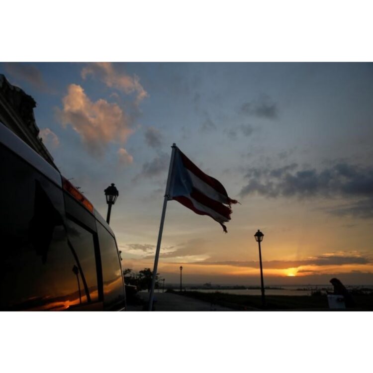 A tattered flag of Puerto Rico flies from a truck parked in the Hurricane Maria affected area of Old San Juan, Puerto Rico. 
REUTERS/Shannon Stapleton