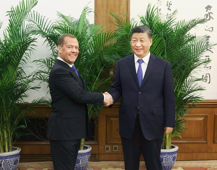 Xi Jinping, General Secretary of the Communist Party of China (CPC) Central Committee and Chinese president, meets with Chairman of the United Russia party Dmitry Medvedev, who visits China at the invitation of the CPC, at the Diaoyutai State Guesthouse in Beijing, capital of China, on December 21 (XINHUA)