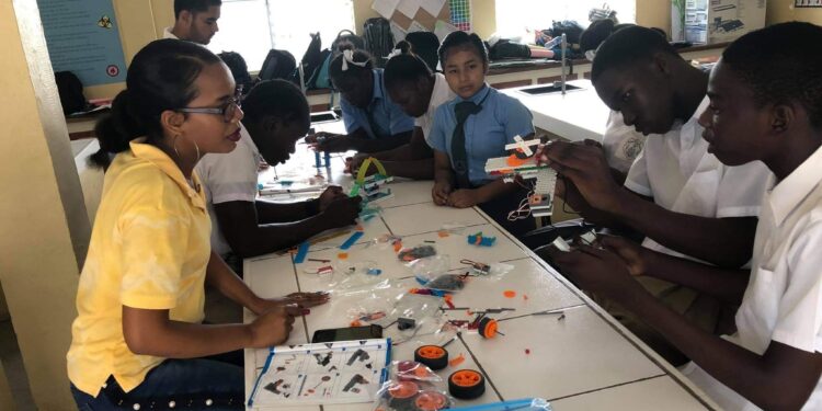 Denica Grant working with a group of students (Bradley Downer Photo)