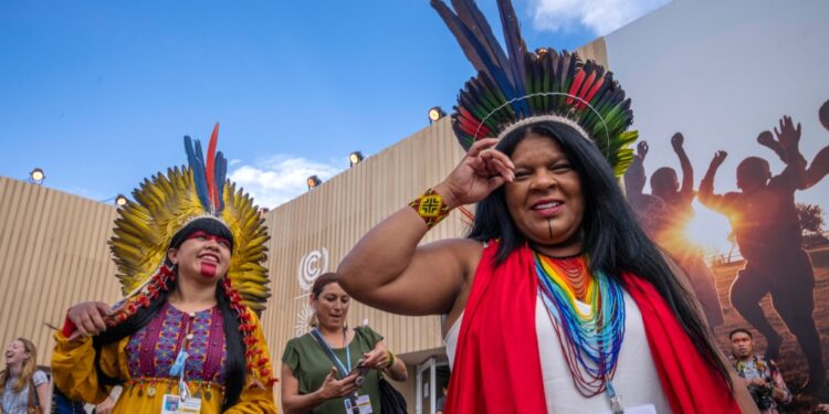 Sonia Guajajara, Indigenous activist, environmentalist and politician from Brazil, right, socializes with woman after holding a panel on Indigenous Women from the Amazon, at the COP27 U.N. Climate Summit, in Sharm el-Sheikh, Egypt, Monday, Nov. 14, 2022. (AP Photo/Nariman El-Mofty)