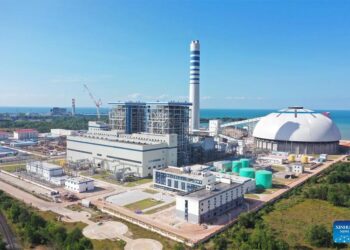 This aerial photo taken on Dec. 16, 2022 shows the Huadian Preah Sihanouk 2×350 MW Coal-fired Power Plant in Preah Sihanouk province, Cambodia. The Huadian Preah Sihanouk coal-fired power plant in Cambodia on Friday passed a commissioning test successfully and was officially put into operation, becoming the largest power generation project in the country.(Photo by Li Xinlin/Xinhua)