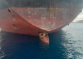 In this photo released by Spain's Maritime Safety and Rescue Society on Tuesday Nov. 29, 2022, three men are photographed on an oil tanker anchored in the port of the Canary Islands, Spain. Spain’s Maritime Rescue Service says it has rescued three stowaways traveling on a ship’s rudder in the Canary Islands after the vessel sailed there from Nigeria. The men were found on the Alithini II oil tanker at the Las Palmas port. (Salvamento Maritimo via AP)