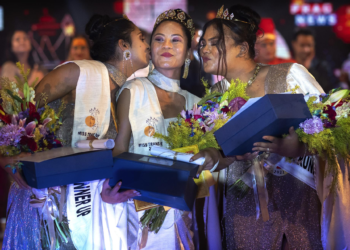 Winner of Miss Trans Northeast 22, Lucey Ham, center, with first runner-up Aria Deka, right, and Rishidhya Sangkarishan as second runner up pose for a photograph in Guwahati, India, Wednesday, Nov. 30, 2022. (AP Photo/Anupam Nath)