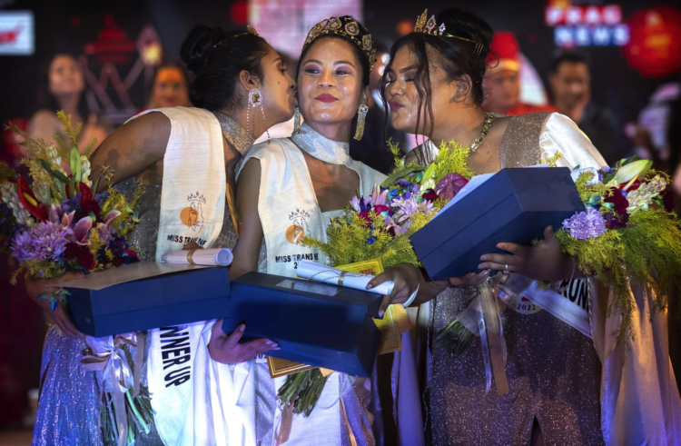 Winner of Miss Trans Northeast 22, Lucey Ham, center, with first runner-up Aria Deka, right, and Rishidhya Sangkarishan as second runner up pose for a photograph in Guwahati, India, Wednesday, Nov. 30, 2022. (AP Photo/Anupam Nath)