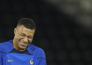 France's Kylian Mbappe jokes during a training session at the Jassim Bin Hamad stadium in Doha, Qatar, Thursday, Dec. 8, 2022. France will play against England during their World Cup quarter-final soccer match on Dec. 10. (AP Photo/Christophe Ena)
