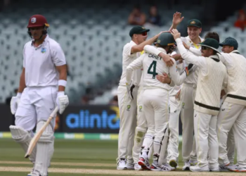 Australian players celebrate the wicket of West Indies wicketkeeper Joshua de Silva (left) on the fourth day of the second Test in Adelaide. Photograph: James Elsby/AP