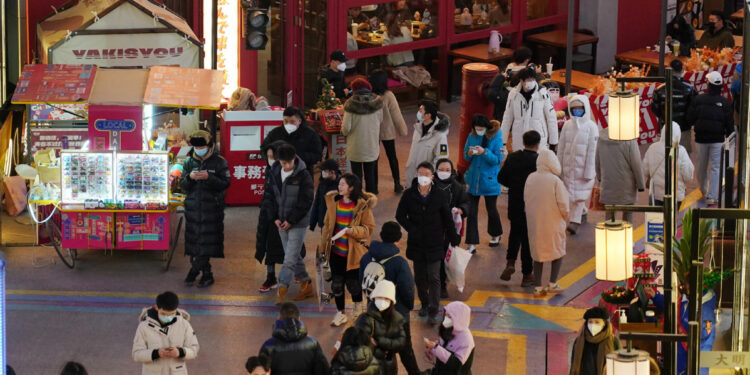 People enjoy leisure time at a business center in Beijing, Dec 25, 2022. [Photo/Xinhua]