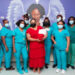 First Lady with Christmas baby and staff of maternity ward