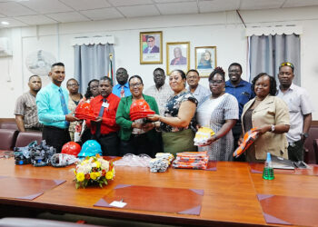Deputy Chief Education Officer (Technical), Dr. Ritesh Tularam handing-over the items to teachers of the schools today