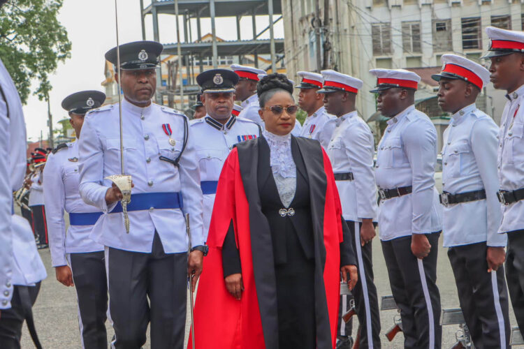 Acting Chancellor of the Judiciary, Yonette Cummings-Edwards inspecting the guard of honour (Department of Public Information photo)