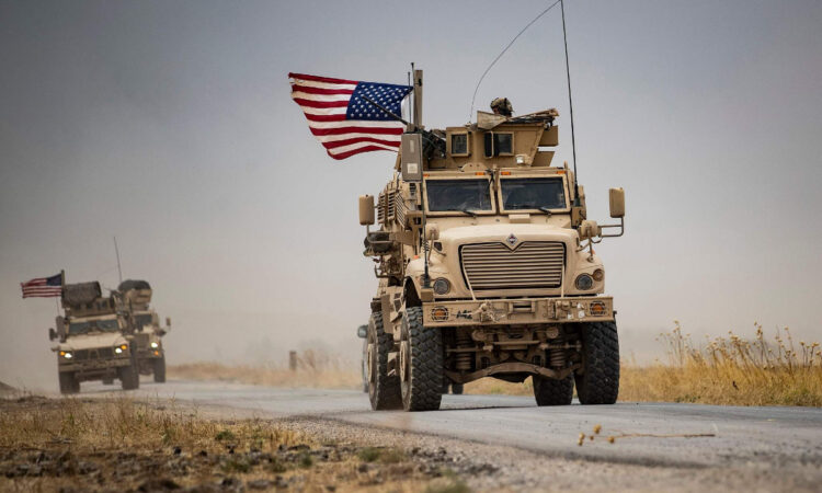 US military vehicles drive by an oil field in northeastern Syria on July 1, 2020. File photo: VCG