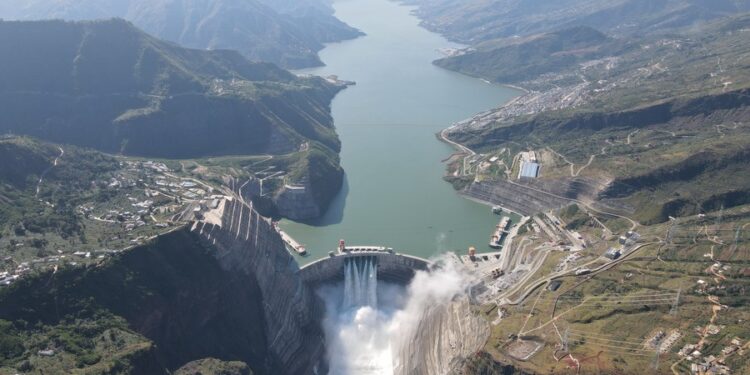 A flood discharging experiment is done at the Baihetan hydropower station, which straddles the provinces of Yunnan and Sichuan in southwest China, Oct. 29, 2022. (Xinhua/Liao Wangjie)