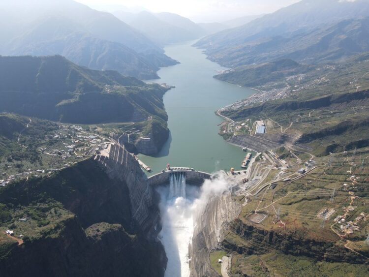 A flood discharging experiment is done at the Baihetan hydropower station, which straddles the provinces of Yunnan and Sichuan in southwest China, Oct. 29, 2022. (Xinhua/Liao Wangjie)