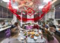 A family gathers to have dinner together on Lunar New Year's Eve in southwest China's Guizhou Province, Jan. 21, 2023. (Photo by Li Hua/Xinhua)