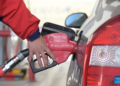 A staff member refuels a vehicle at a gas station in Mengzi City, southwest China's Yunnan Province, Jan. 3, 2023.