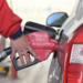 A staff member refuels a vehicle at a gas station in Mengzi City, southwest China's Yunnan Province, Jan. 3, 2023.