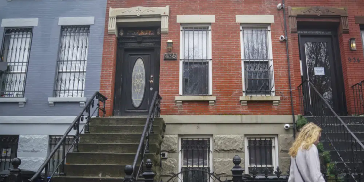 A building, center, owned by New York Mayor Eric Adams, located at 936 Lafayette Avenue in the Bedford-Stuyvesant neighborhood in the Brooklyn borough of New York, is shown Wednesday Dec. 7, 2022. (AP Photo/Bebeto Matthews)